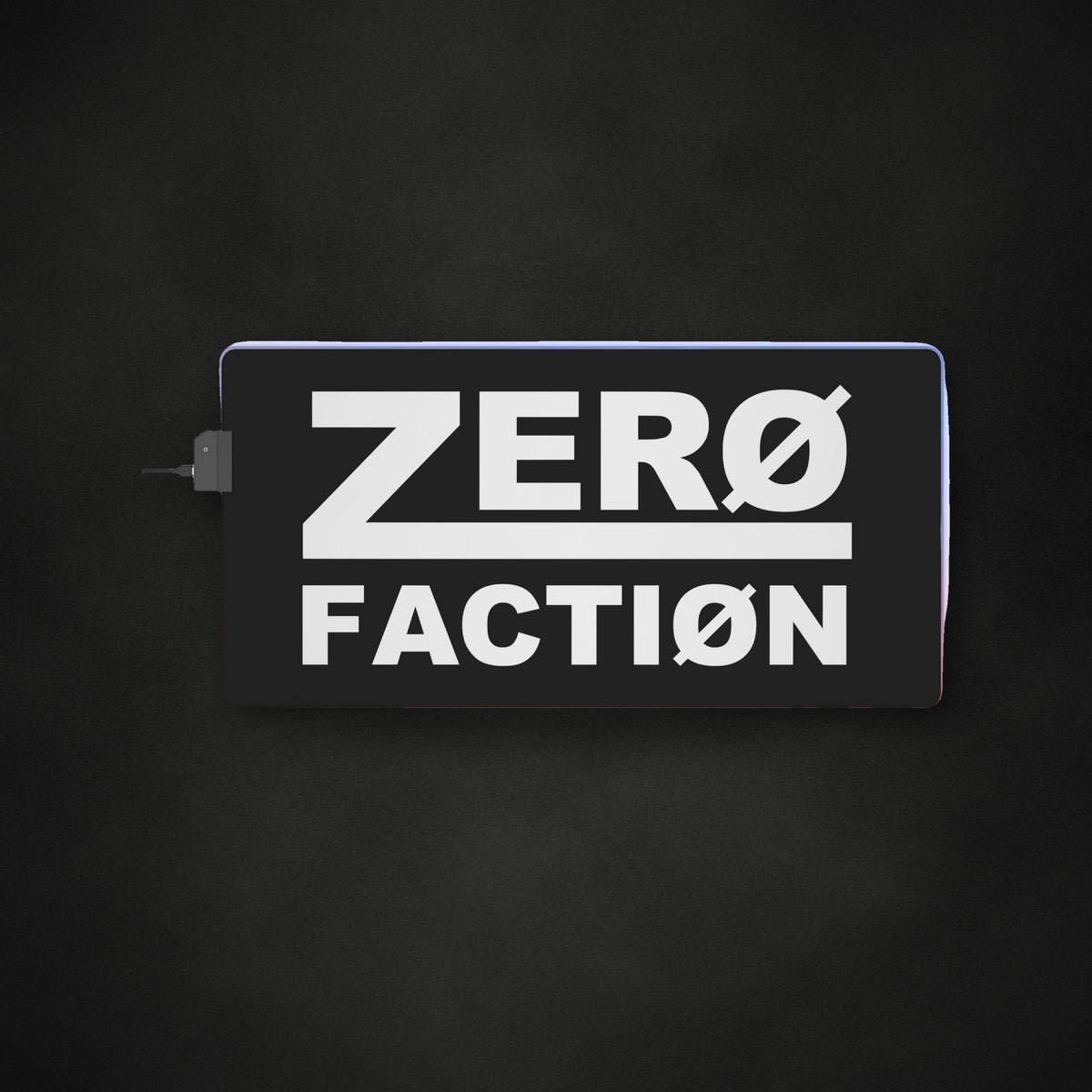 Zero Faction LED Gaming Mouse Pad, on dark asphalt backdrop